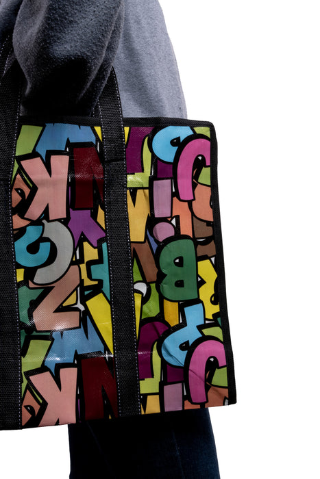 Bolsa de lona con diseño abecedario multicolor 1 pieza.