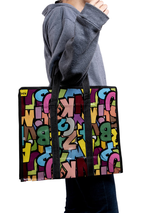 Bolsa de lona con diseño abecedario multicolor 1 pieza.