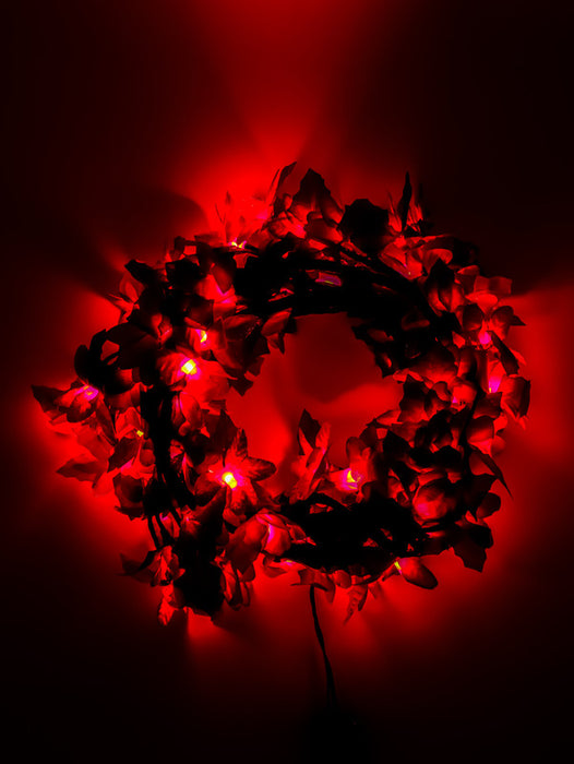 Serie de 120 luces en tono rojo led con modelo de noche buena de tela adiamantado de cable negro para decoracion de navidad