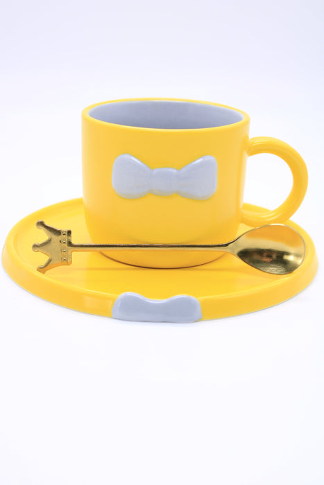 Taza de ceramica con plato y cuchara en colores varios para cafe o te diseño moño elegante