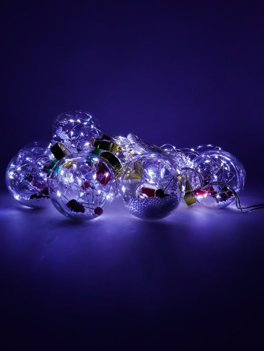 Serie de luces led en forma de esfera transparente con figuras navideñas dentro y 200 leds con 3.2 metros de largo luz blanca