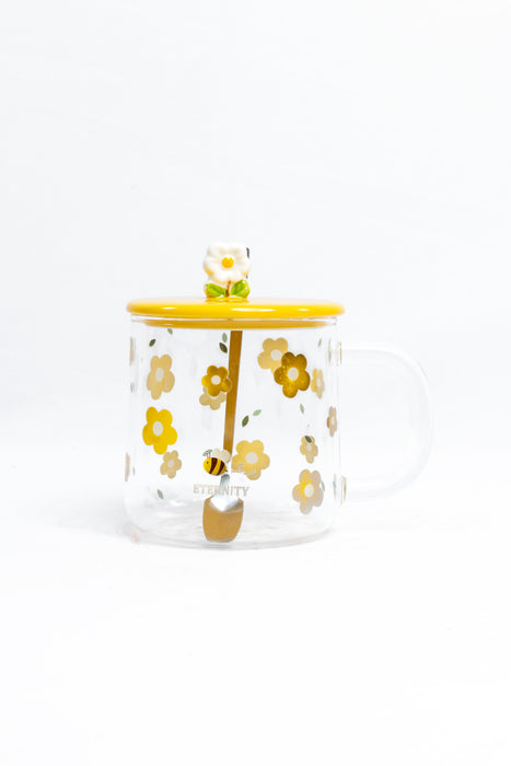 Taza para té transparente con detalles en colores varios y diseño primavera incluye tapa y cuchara