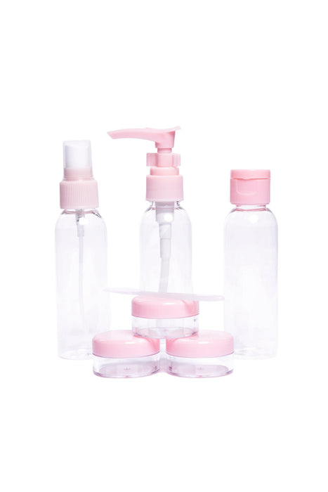 Kit de botellas y tarros de plastico para viaje color rosa ideal para productos de cuidado personal