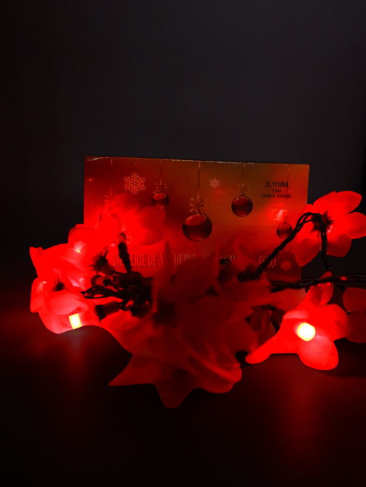 Serie de 20 luces led color rojo decoradas con nochebuenas ideal para esta navidad